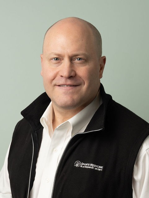 Dr. Shane Woolf, orthopaedic surgeon, in his clinic